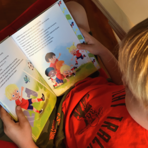 tim tim tom book being read by a boy